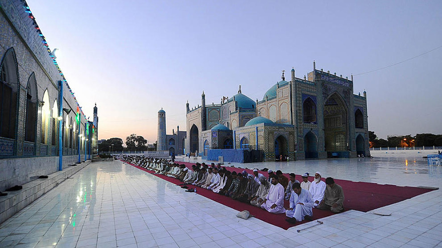 Men praying in Afghanistan