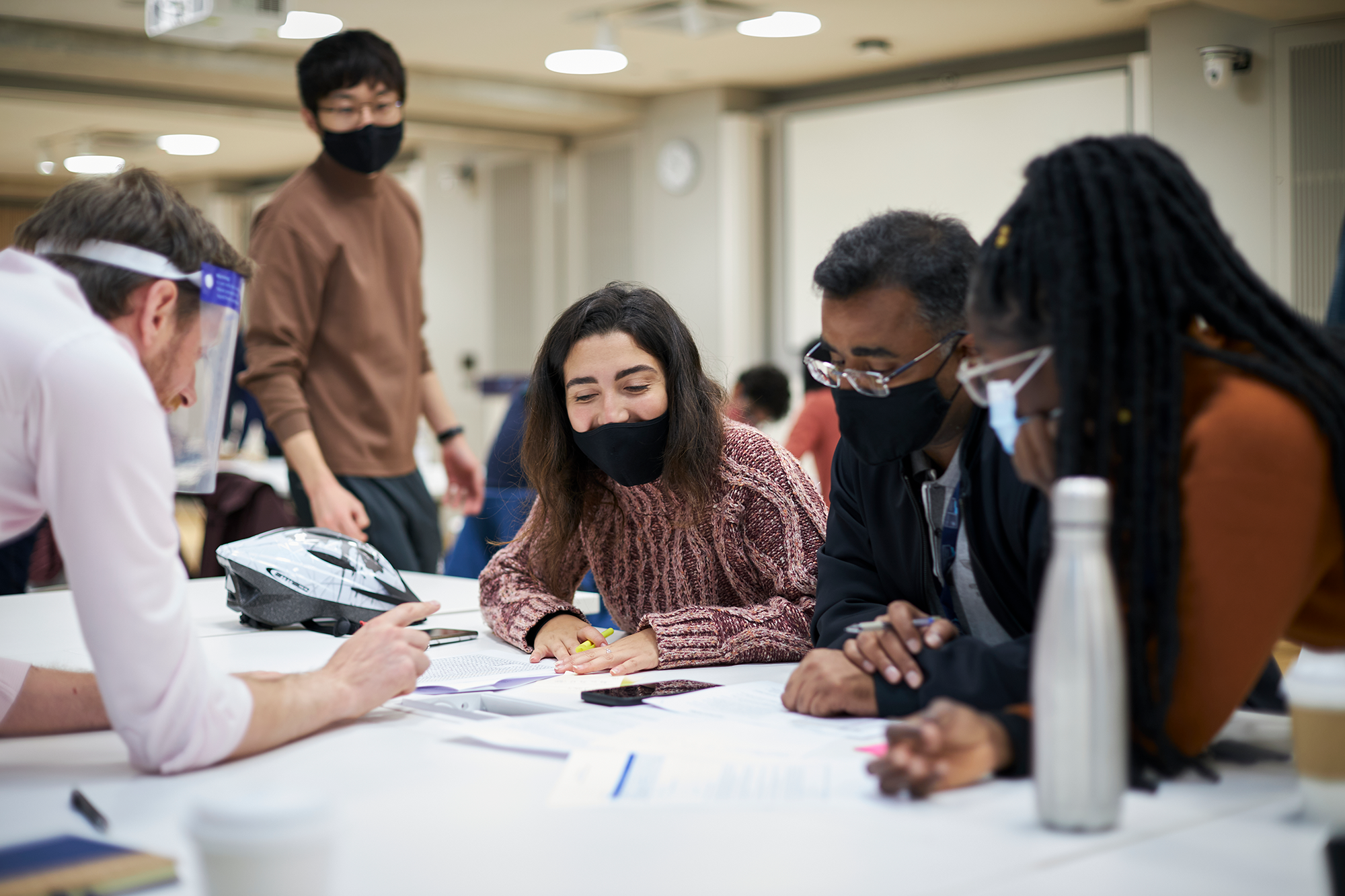 Group of students working together wearing masks