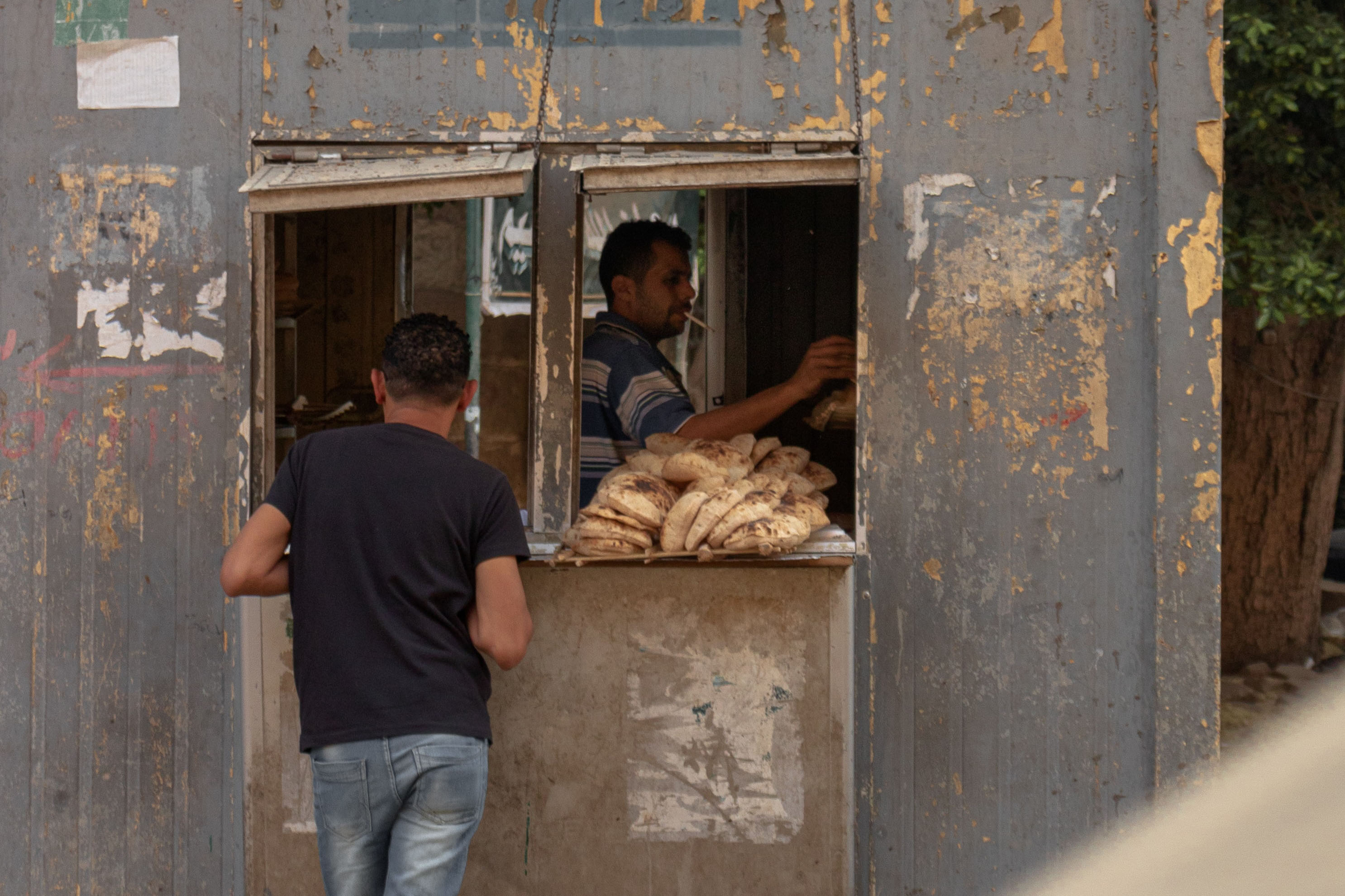 Man selling bread in Cairo, Egypt