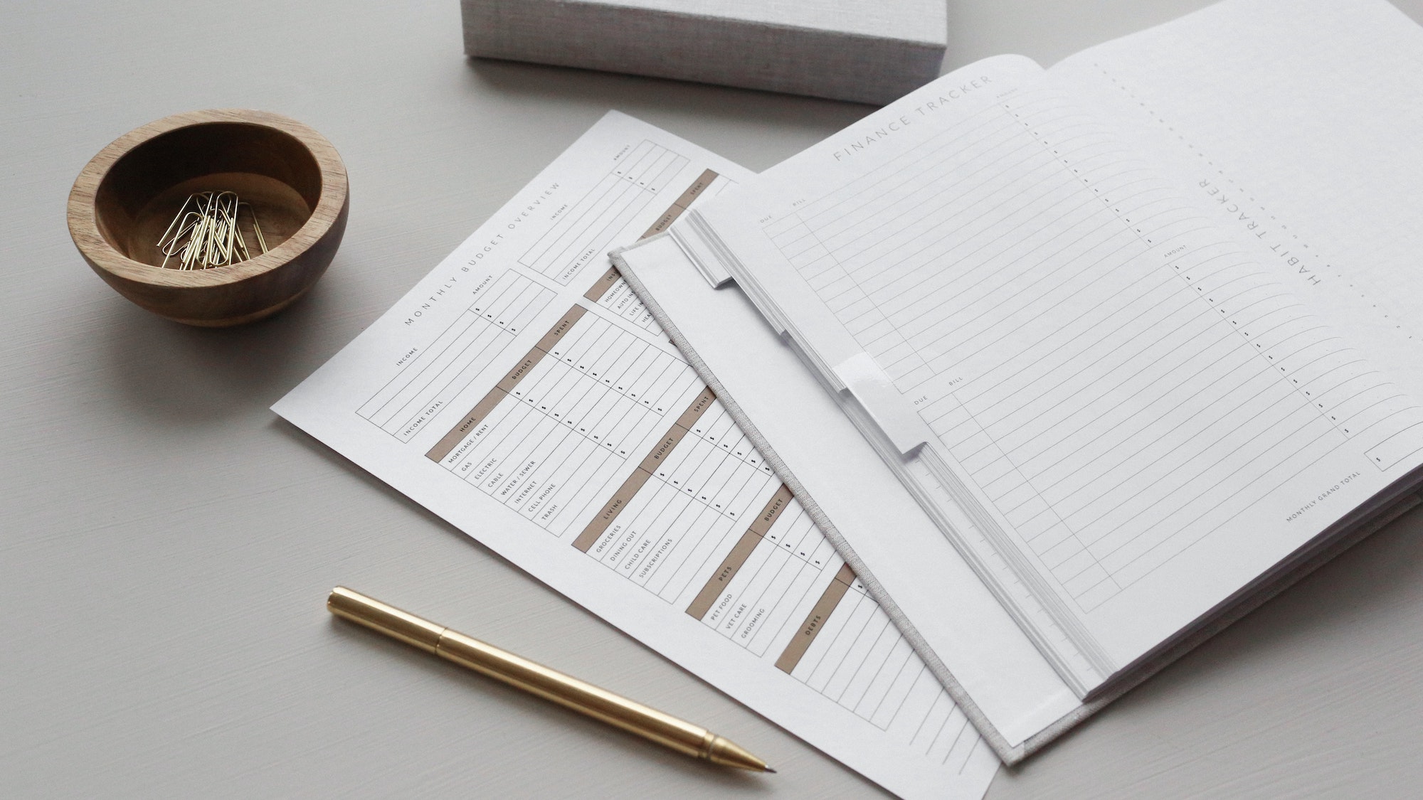 Image shows a budget document with a diary for finance planning