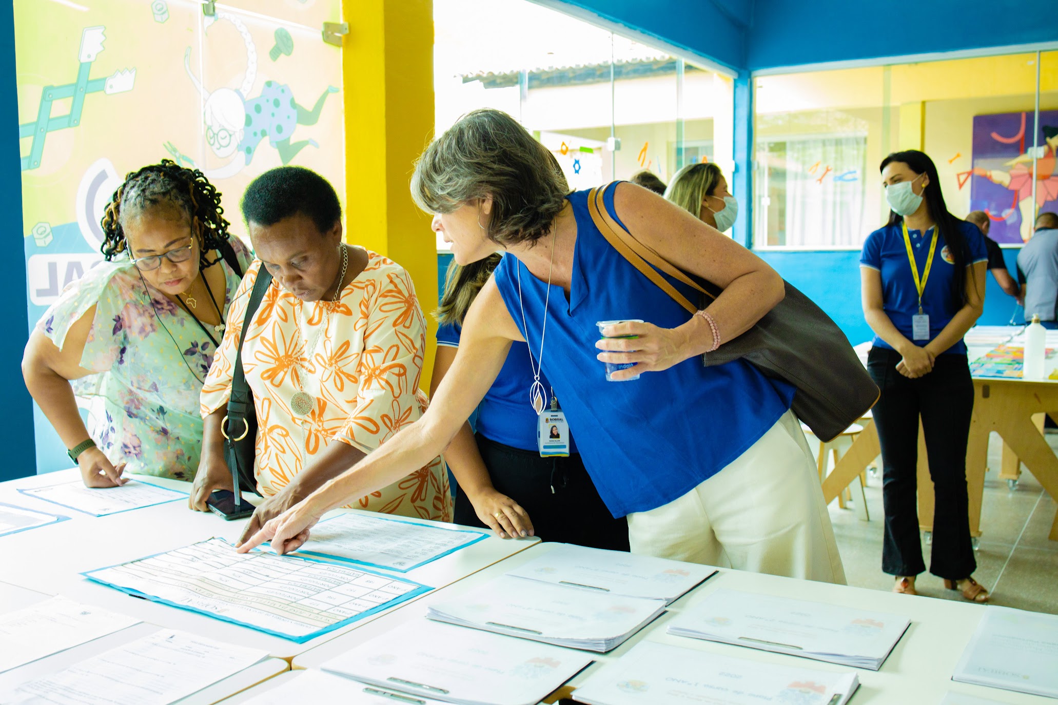 Three women talking during South-South event in Brazil