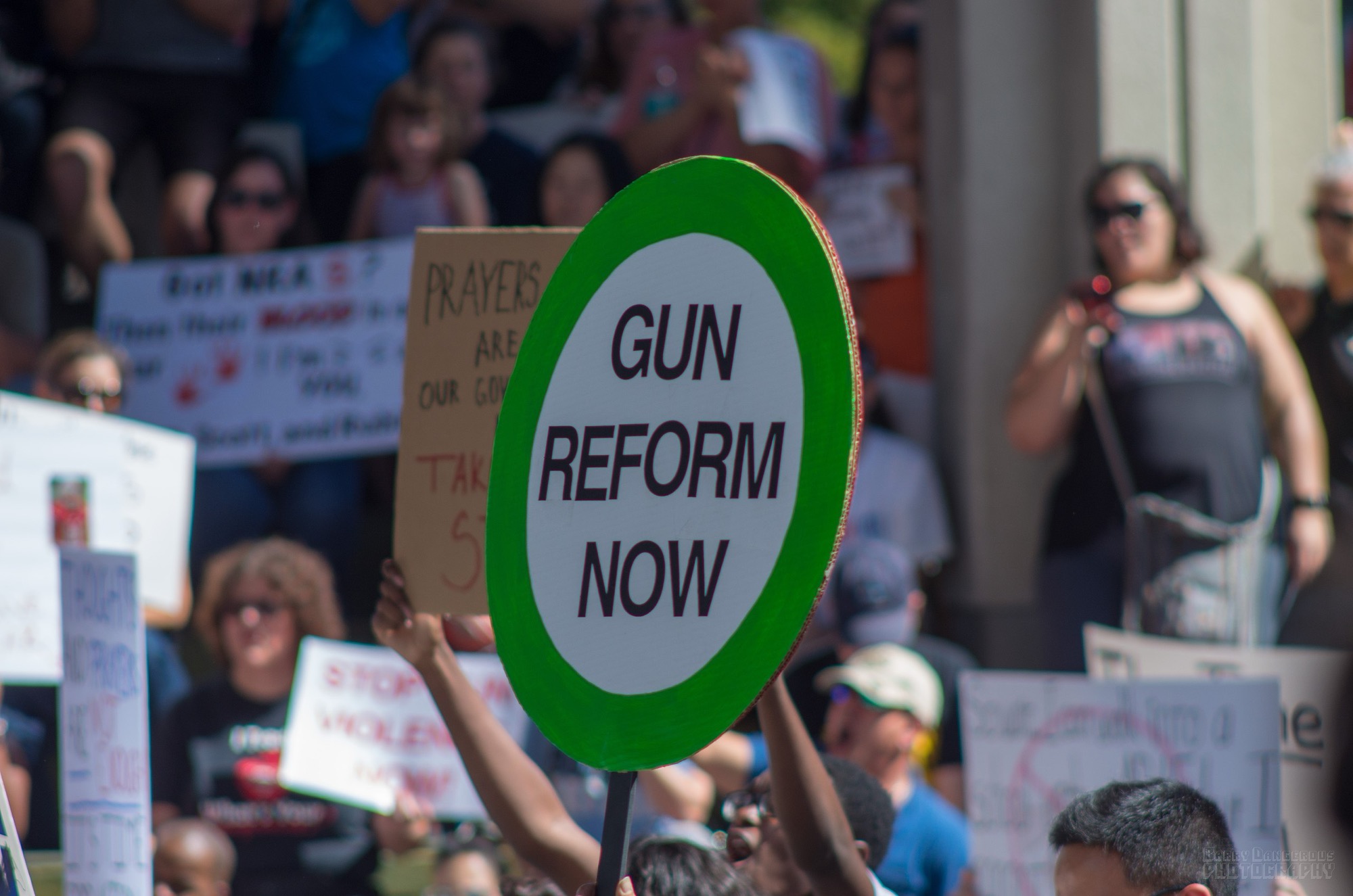 A gun reform protest - close up of a sign in the crowd