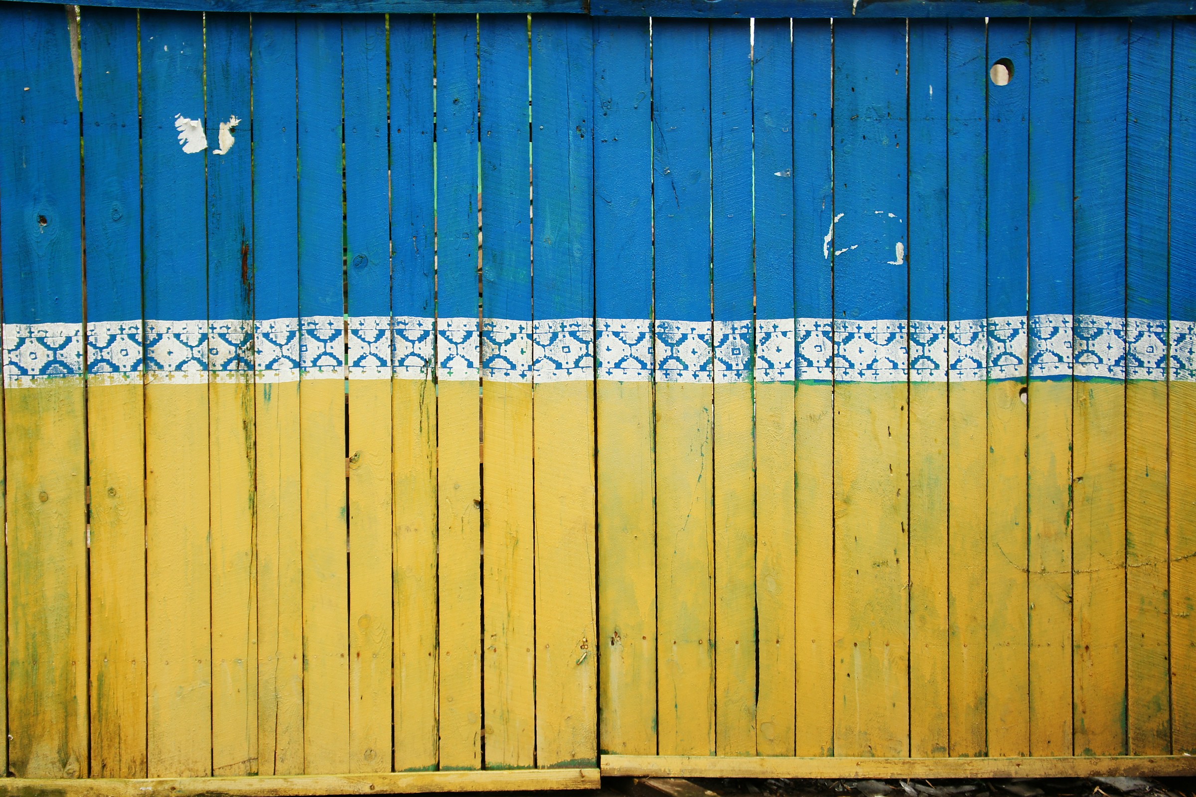 The fence of a construction site in Kiev painted in the colours of the Ukranian flag