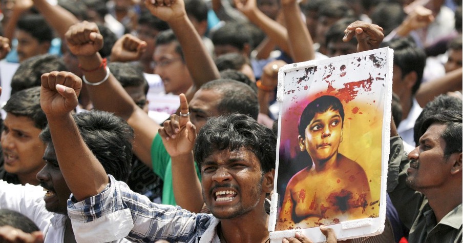 ChatGPT said: A group of protesters with raised fists; one holds a placard showing a young boy with bloodstains, symbolizing outrage over violence or injustice.