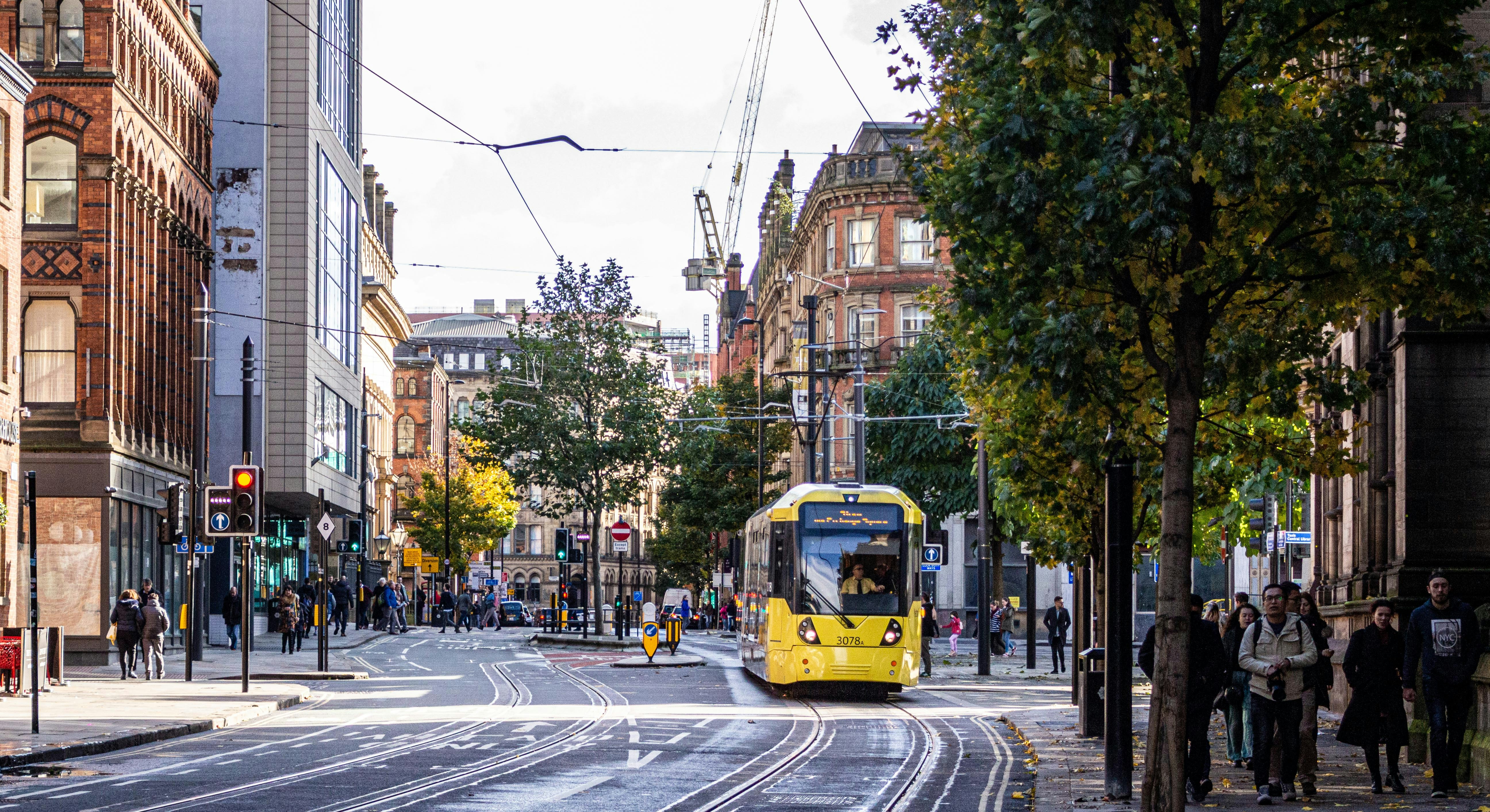 Princess Street, Manchester, UK, with a yellow and black tram