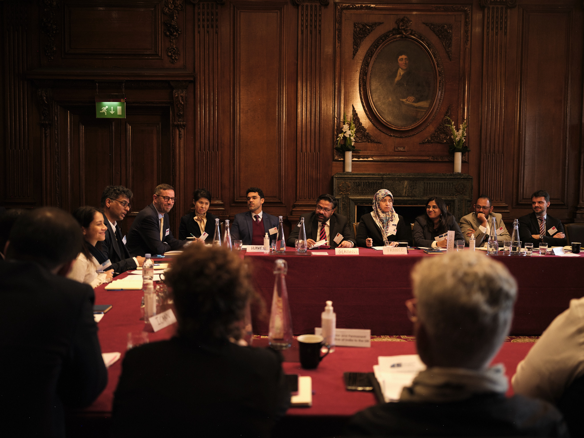 Participants at the table speaking