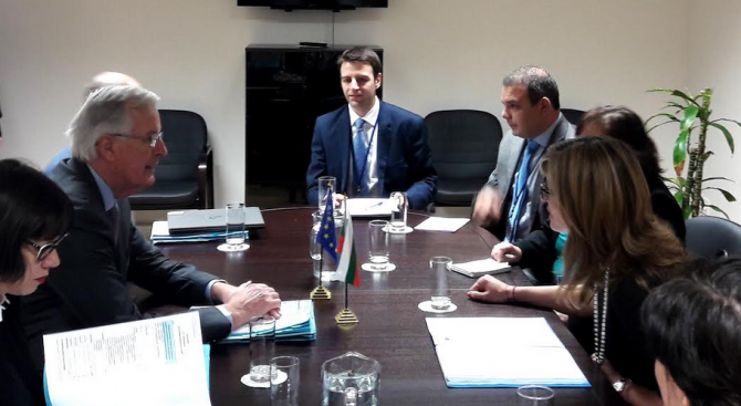 Ivaylo at his workplace with Michel Barnier