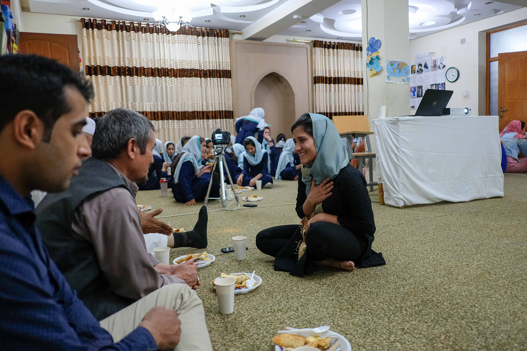 Shabana sitting with students’ families during SOLA’s orientation for the start of the academic year