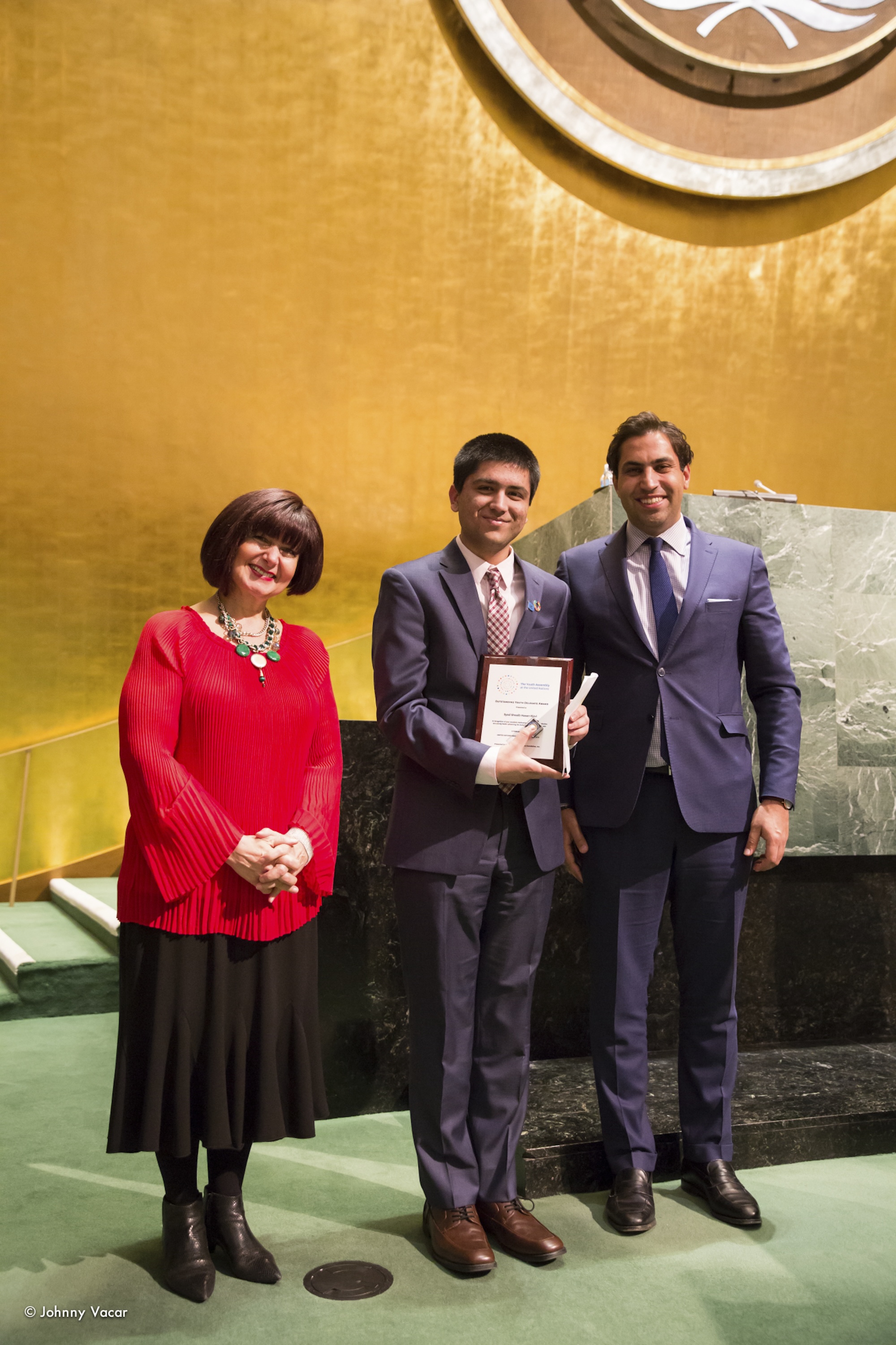 Shoaib Rizvi receives an award from Ambassador Simona-Mirela Miculescu, then Representative of the UN Secretary-General and Head of the UN Office in Belgrade, for his work on women’s empowerment in Pakistan at the 2017 Youth Assembly at the UN General Assembly Hall.