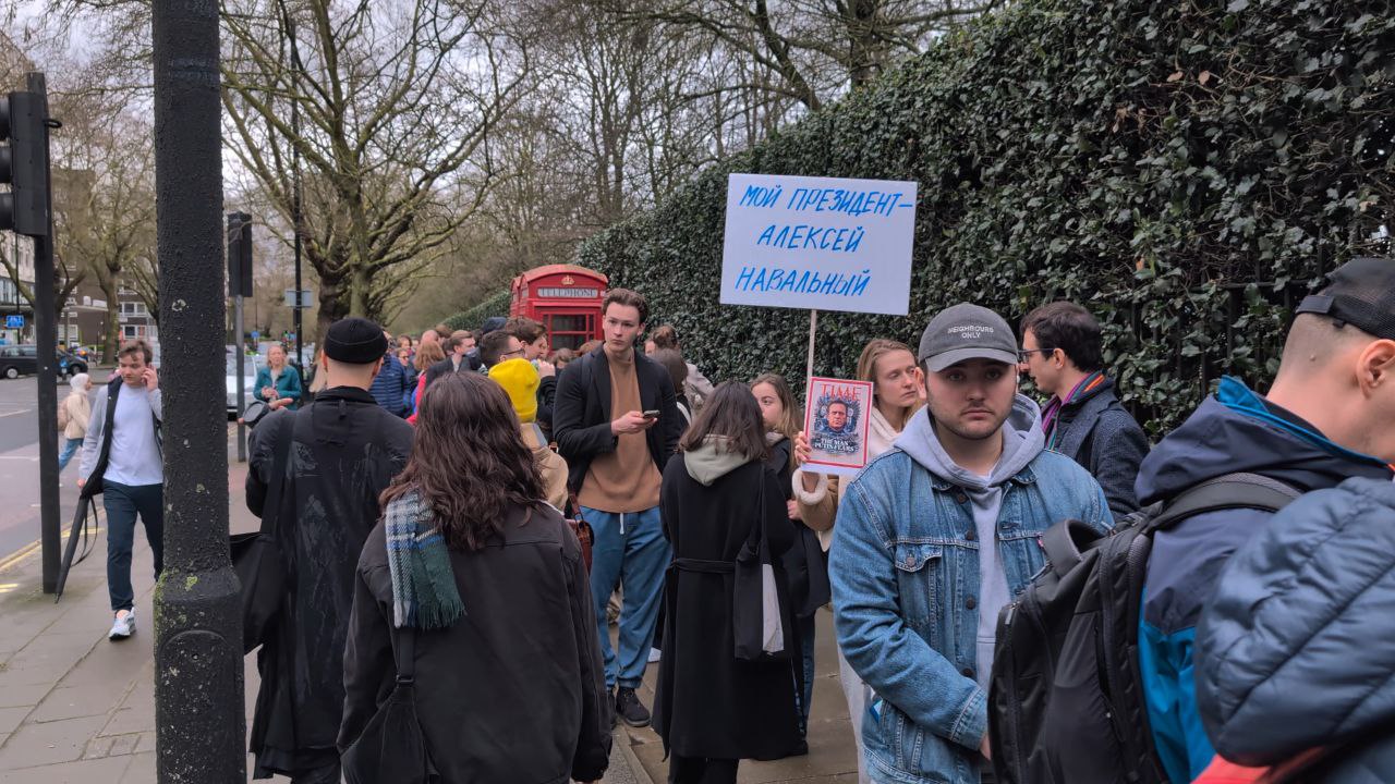 Russians with banners queue to vote at their London embassy on March 17th, 2024. Photo by Vasily Bogantsev.