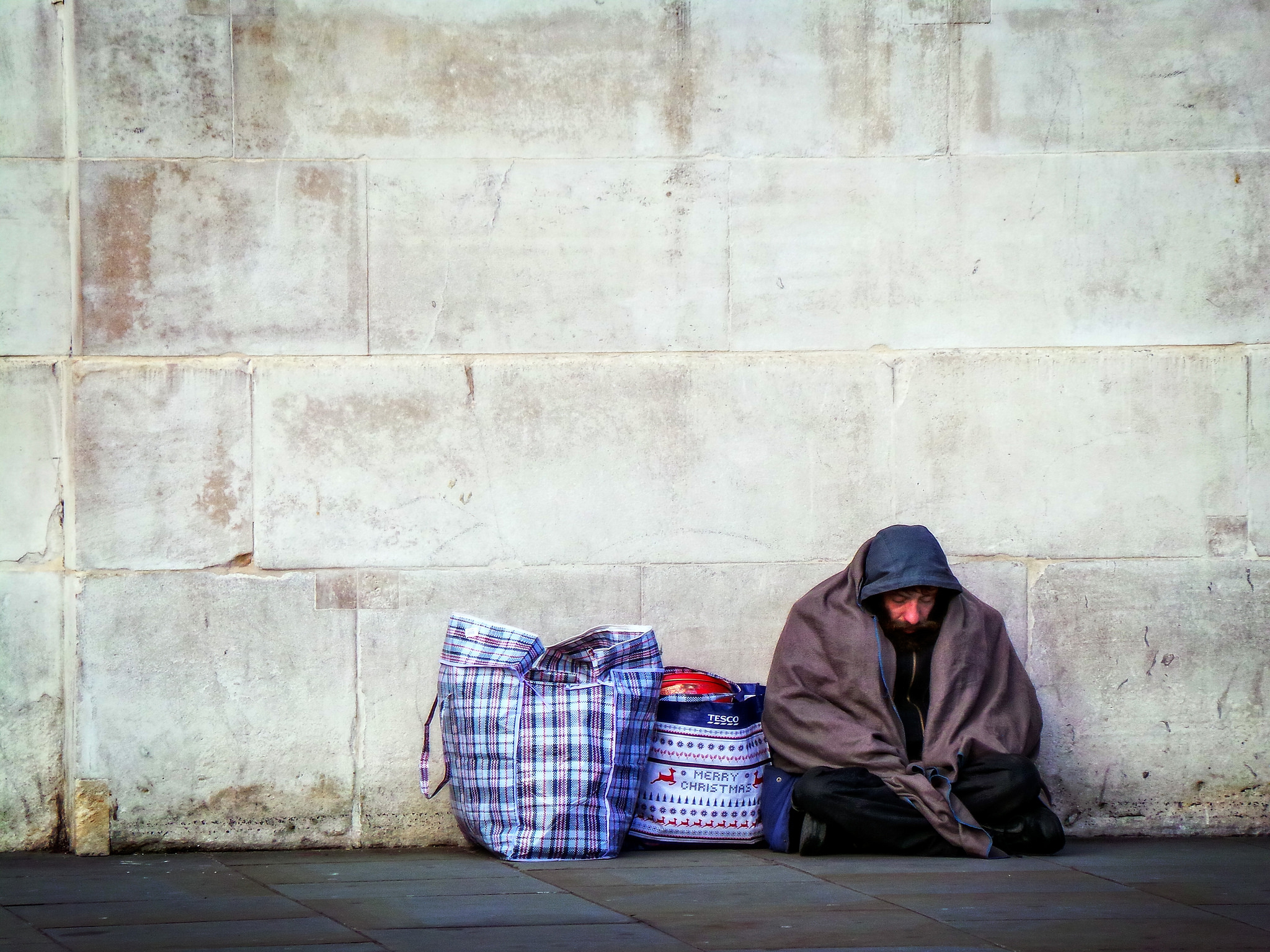 Image: 'Homeless by a Wall', by Garry Knight