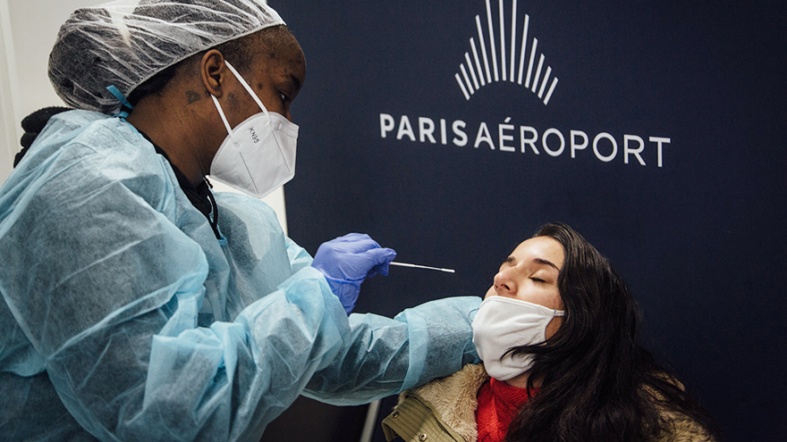A passenger is tested for COVID-19 at Roissy Charles de Gaulle International Airport