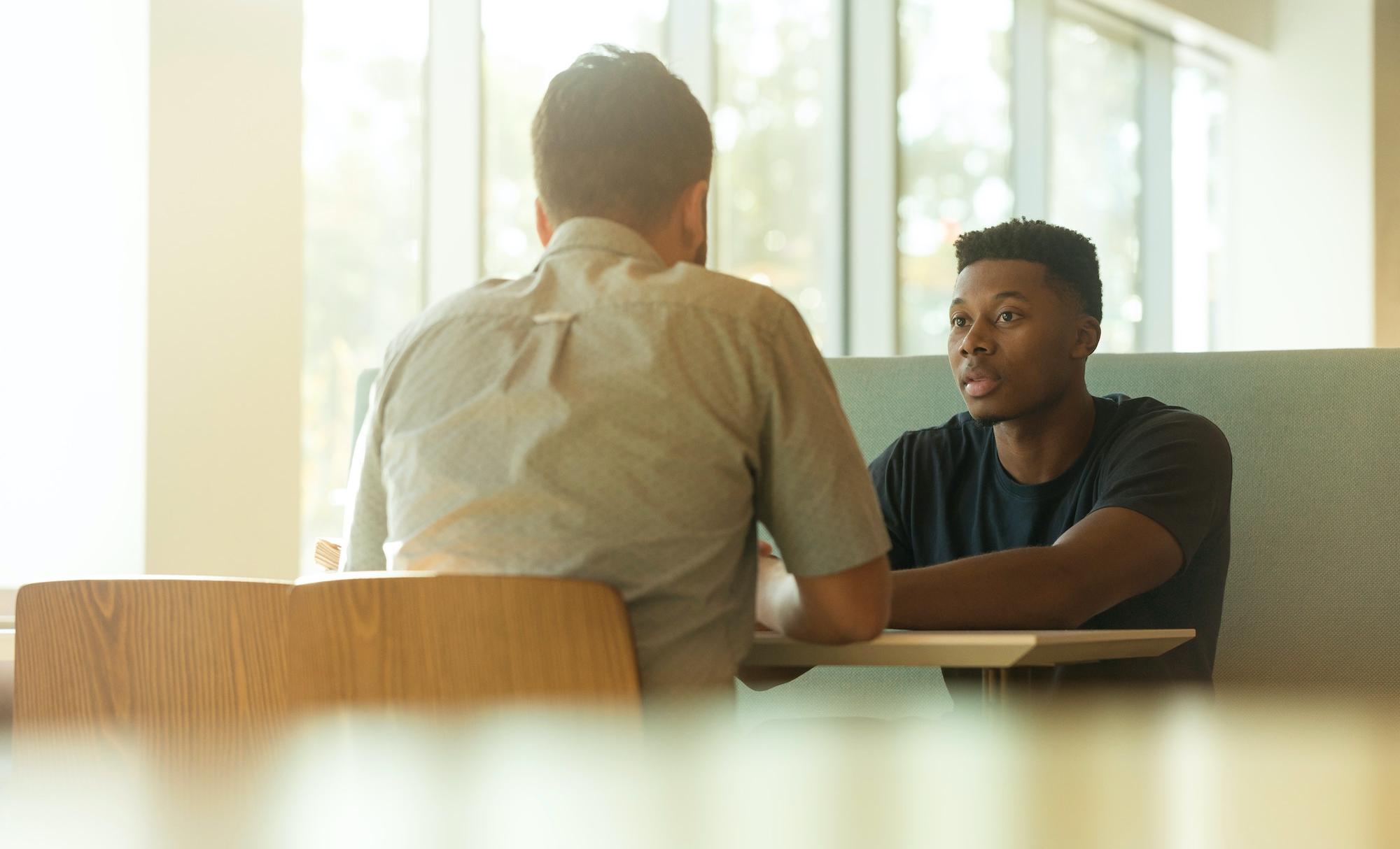 Students talking in a cafe