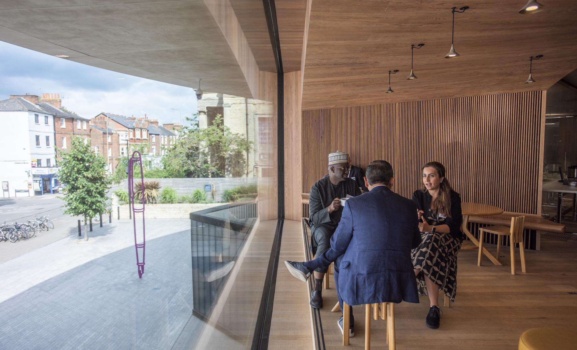 Three people talking in the Window to the world