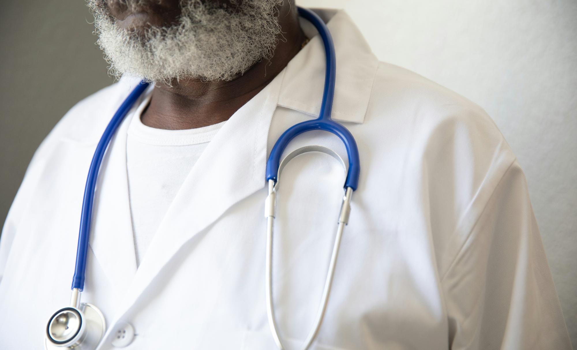 Man with beard wearing a stethoscope