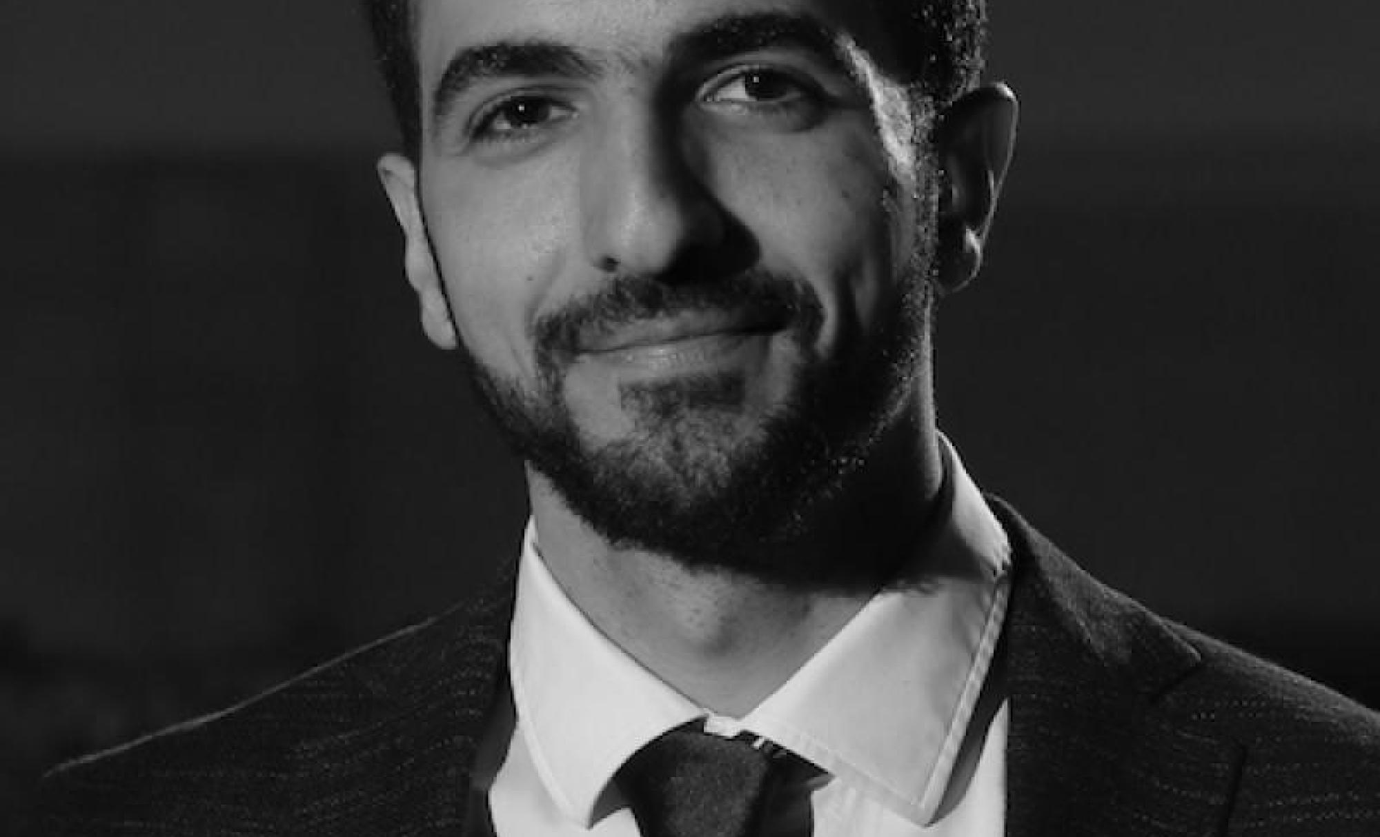 Ibrahim Olabi in a suit