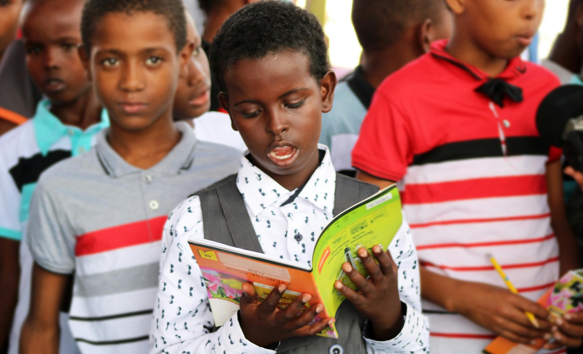 Picture of a Somalian child reading