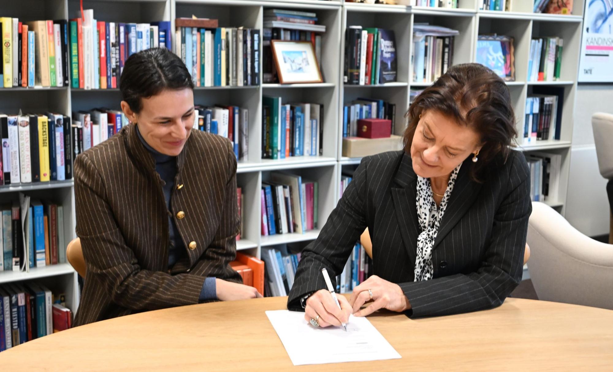 Ngaire signing letter