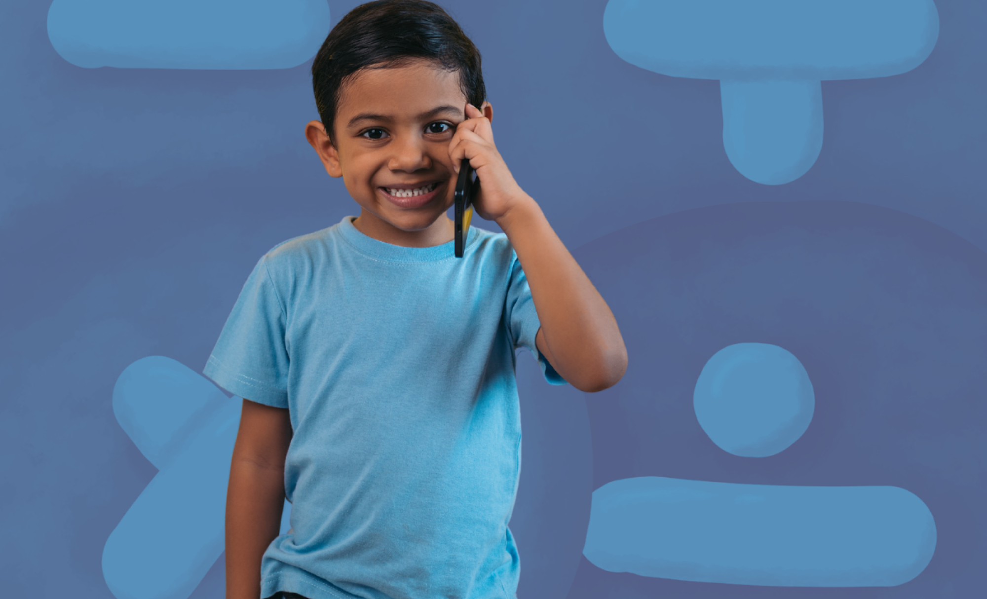 Boy speaking on a mobile phone against abstract background of maths symbols