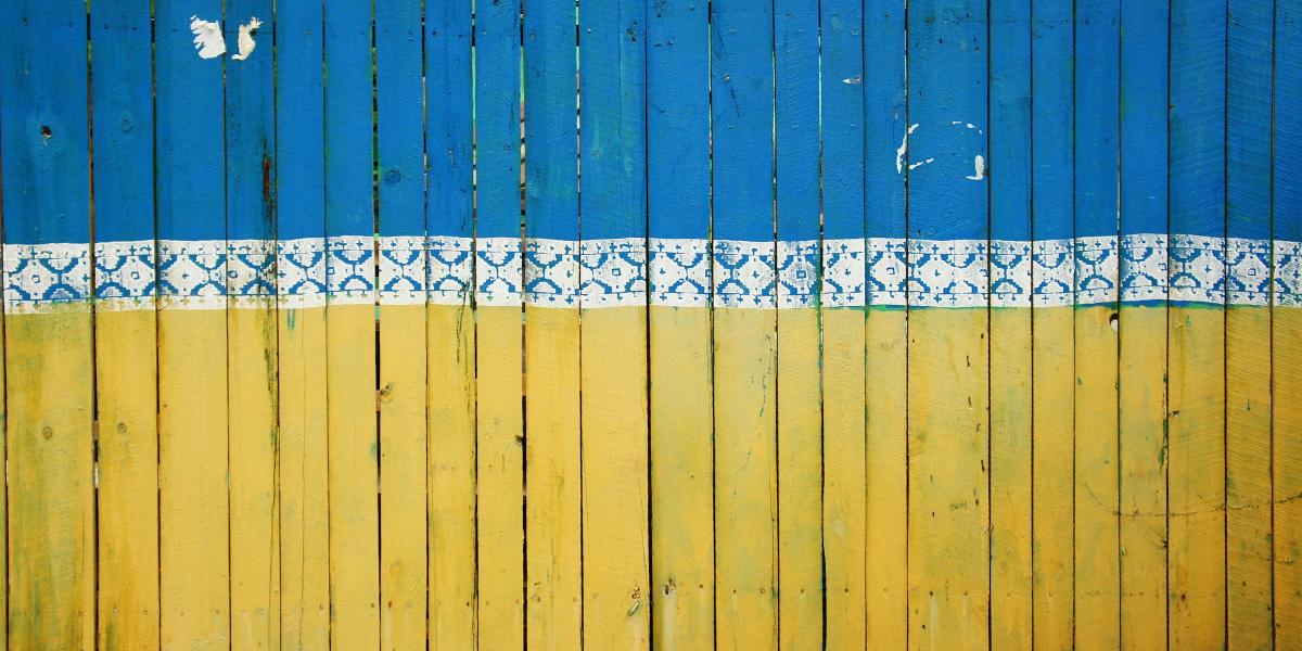 The fence of a construction site in Kiev painted in the colours of the Ukranian flag