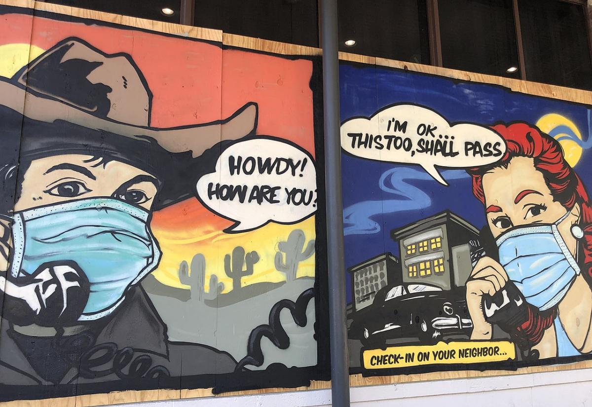 Mural in Austin depicting a cowboy and nurse with facemasks