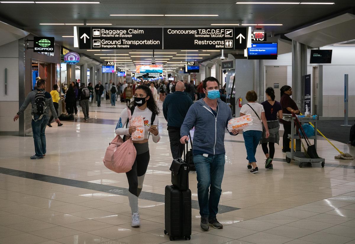 Flyers wearing facemasks at Atlanta International Airport in the United States.