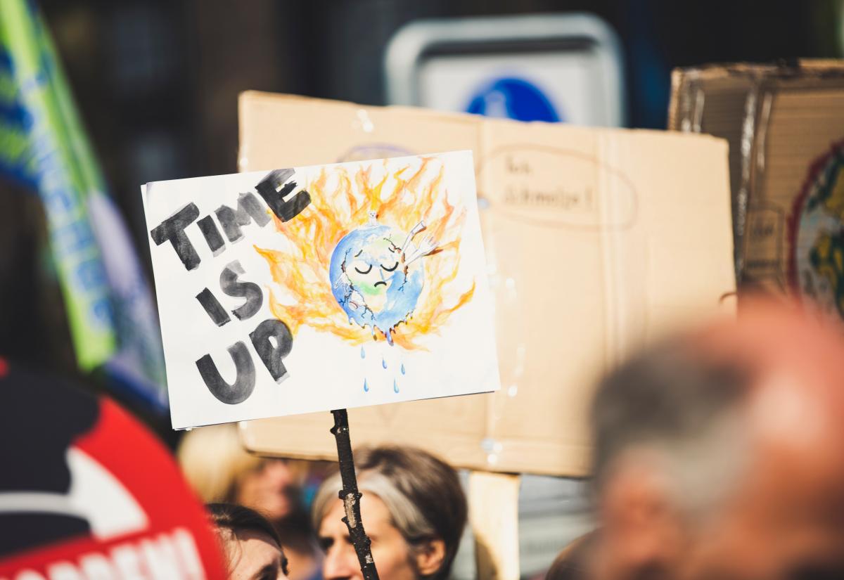 Poster saying "time is up" during a climate change protest