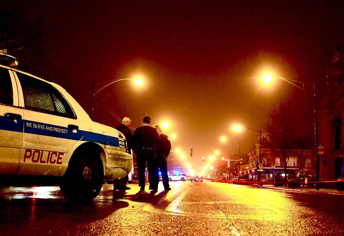 Police at crime scene in Chicago. Photo by J. Knecht on Flickr.