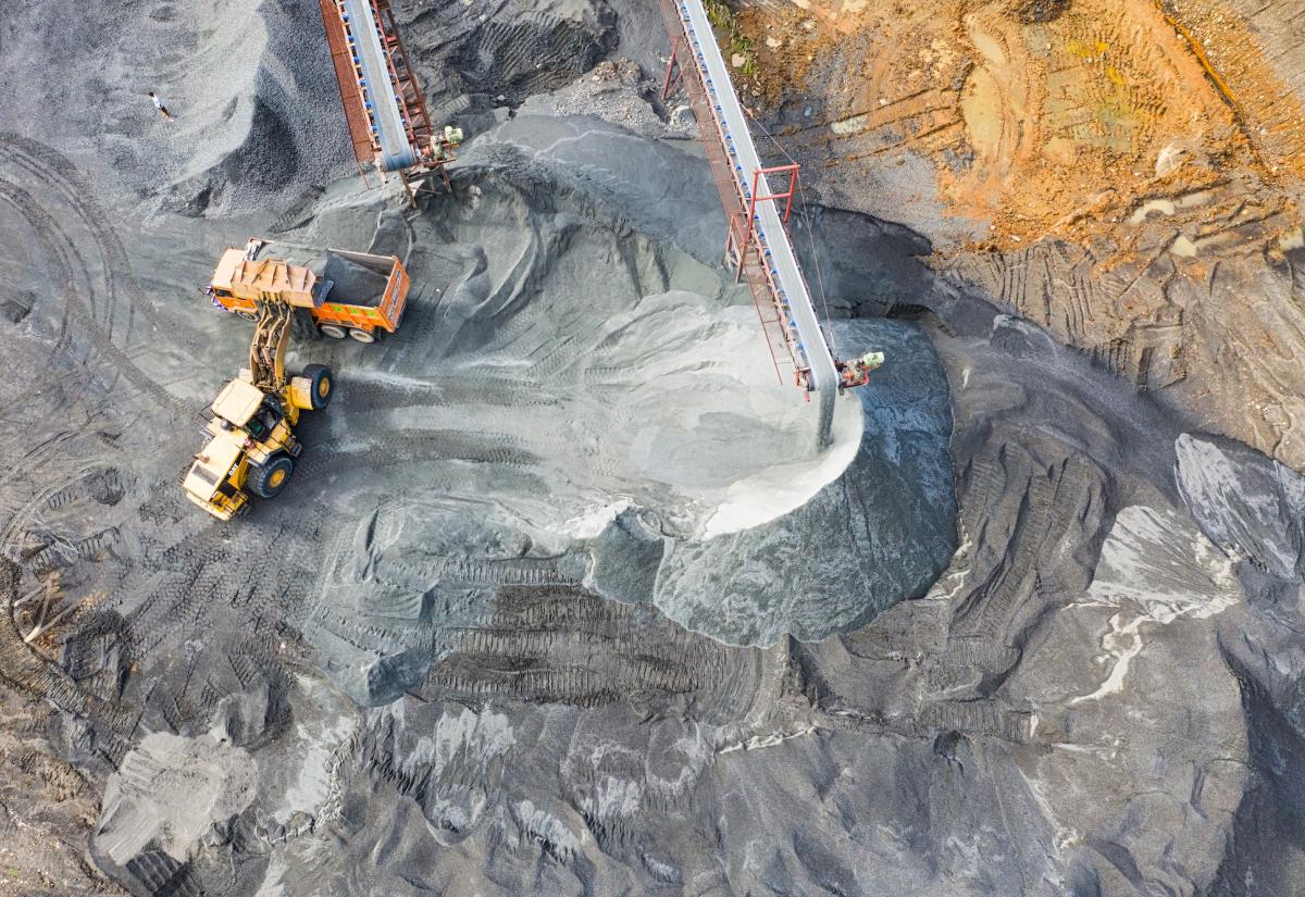 Yellow excavator on a mine