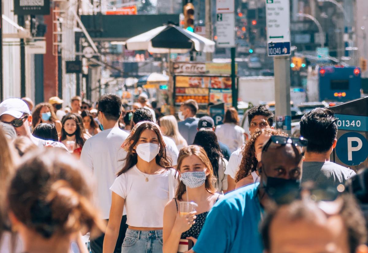 People in a crowd wearing masks