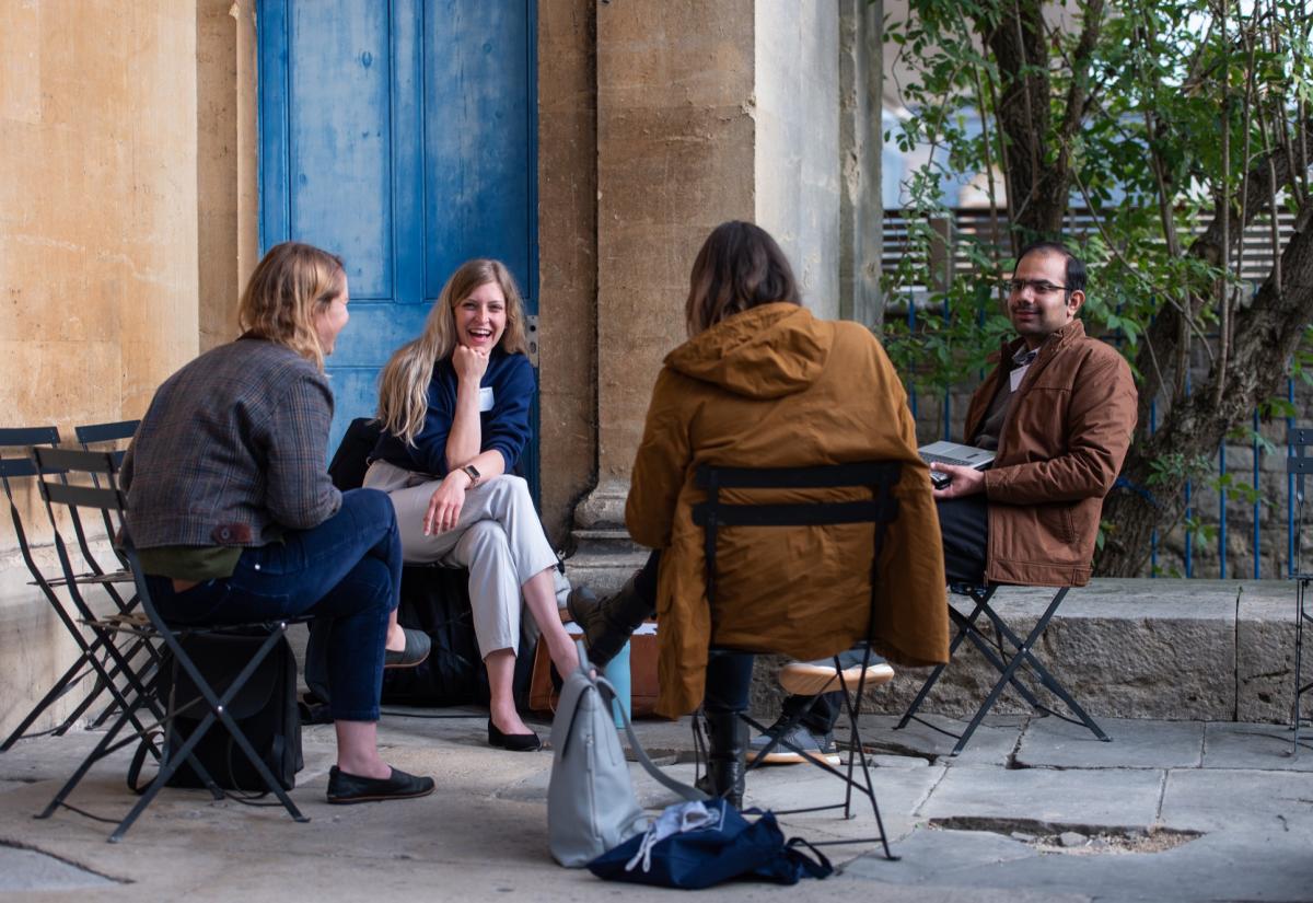 Students sitting outside in discussion