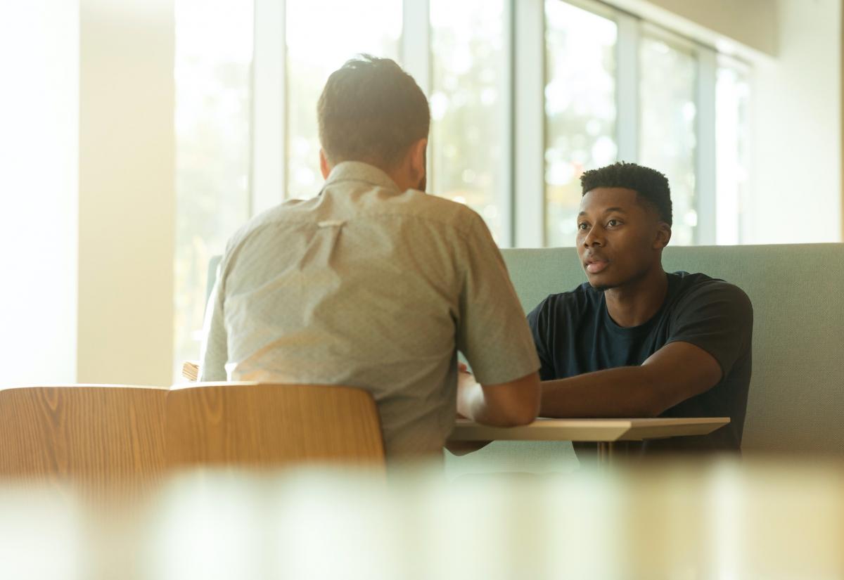 Students talking in a cafe