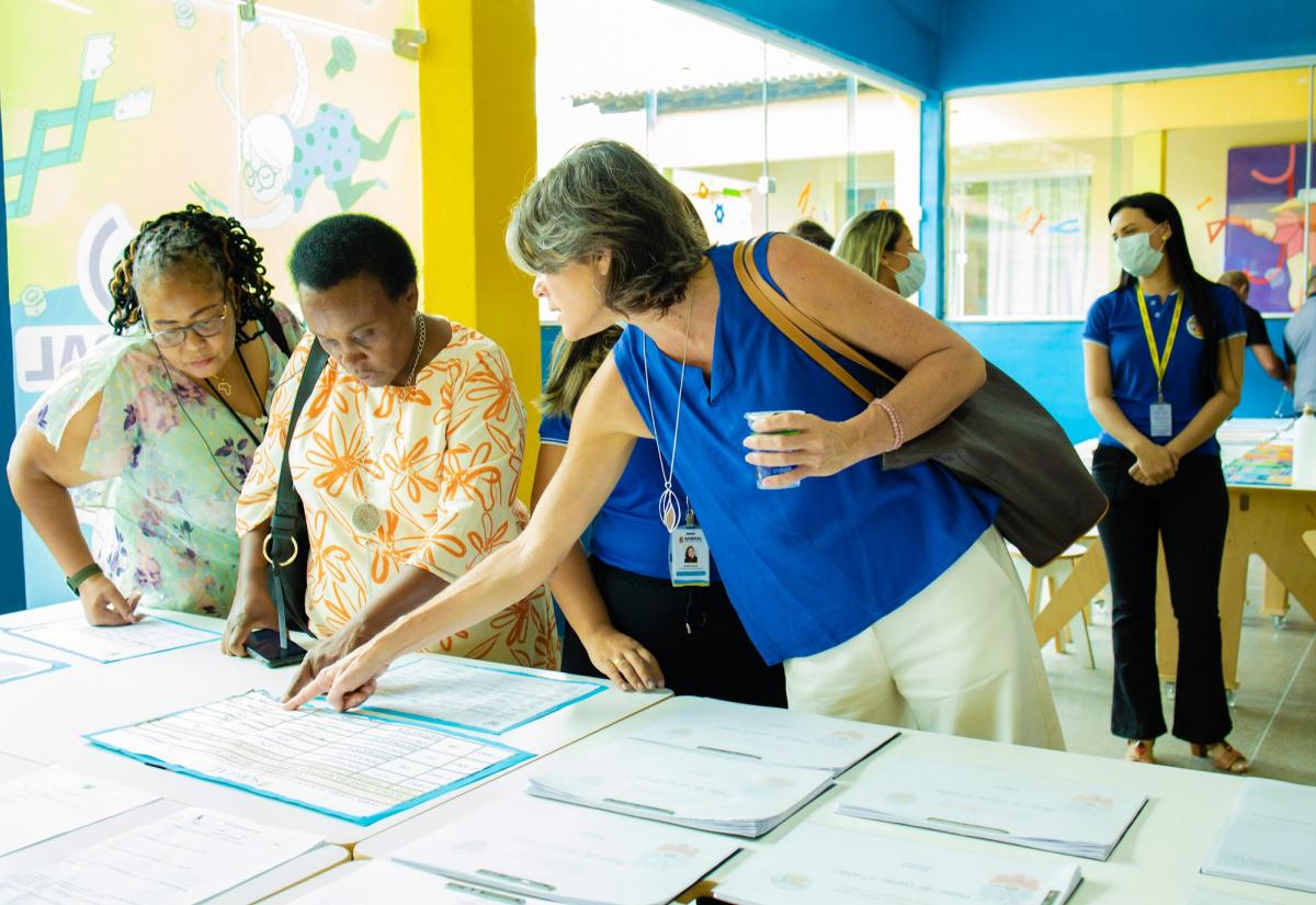 Three women talking during South-South event in Brazil