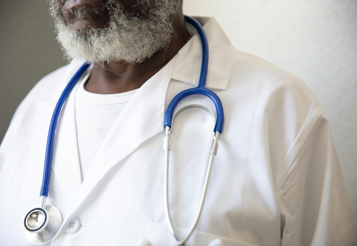 Man with beard wearing a stethoscope
