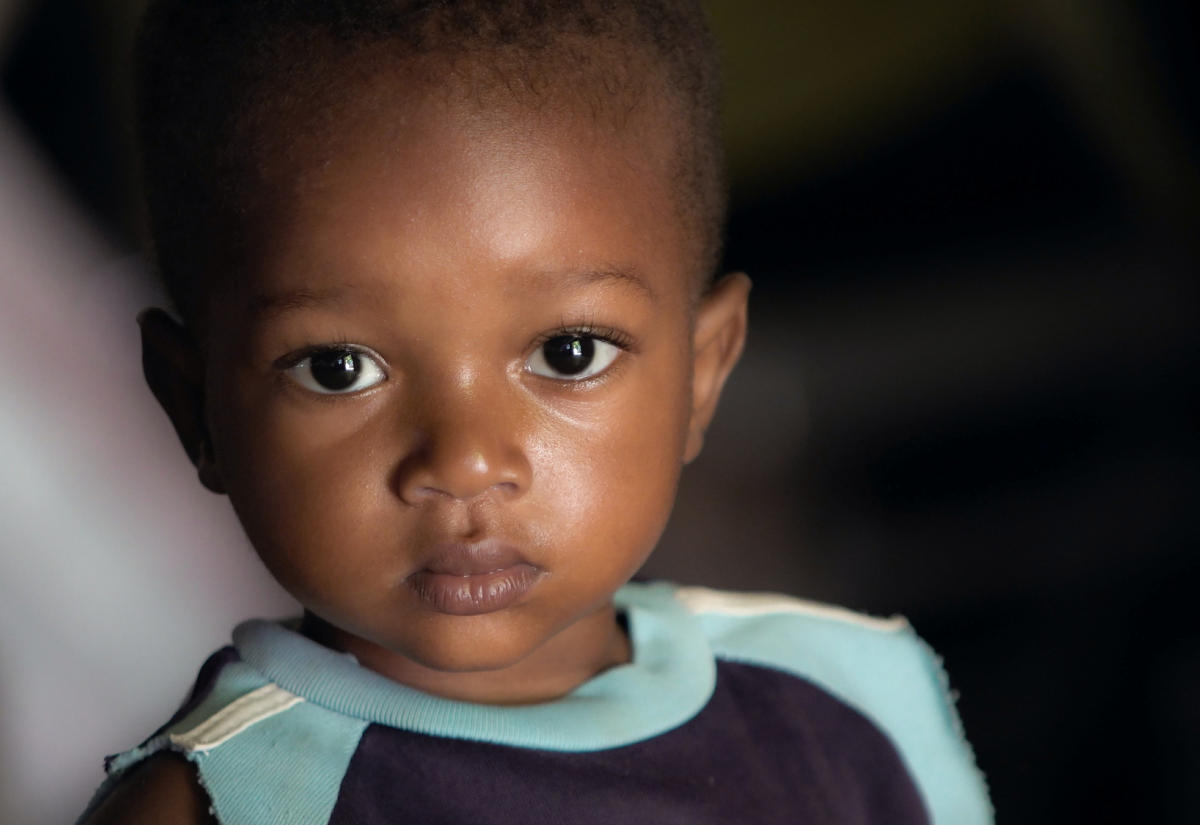 Very young child gazing at camera