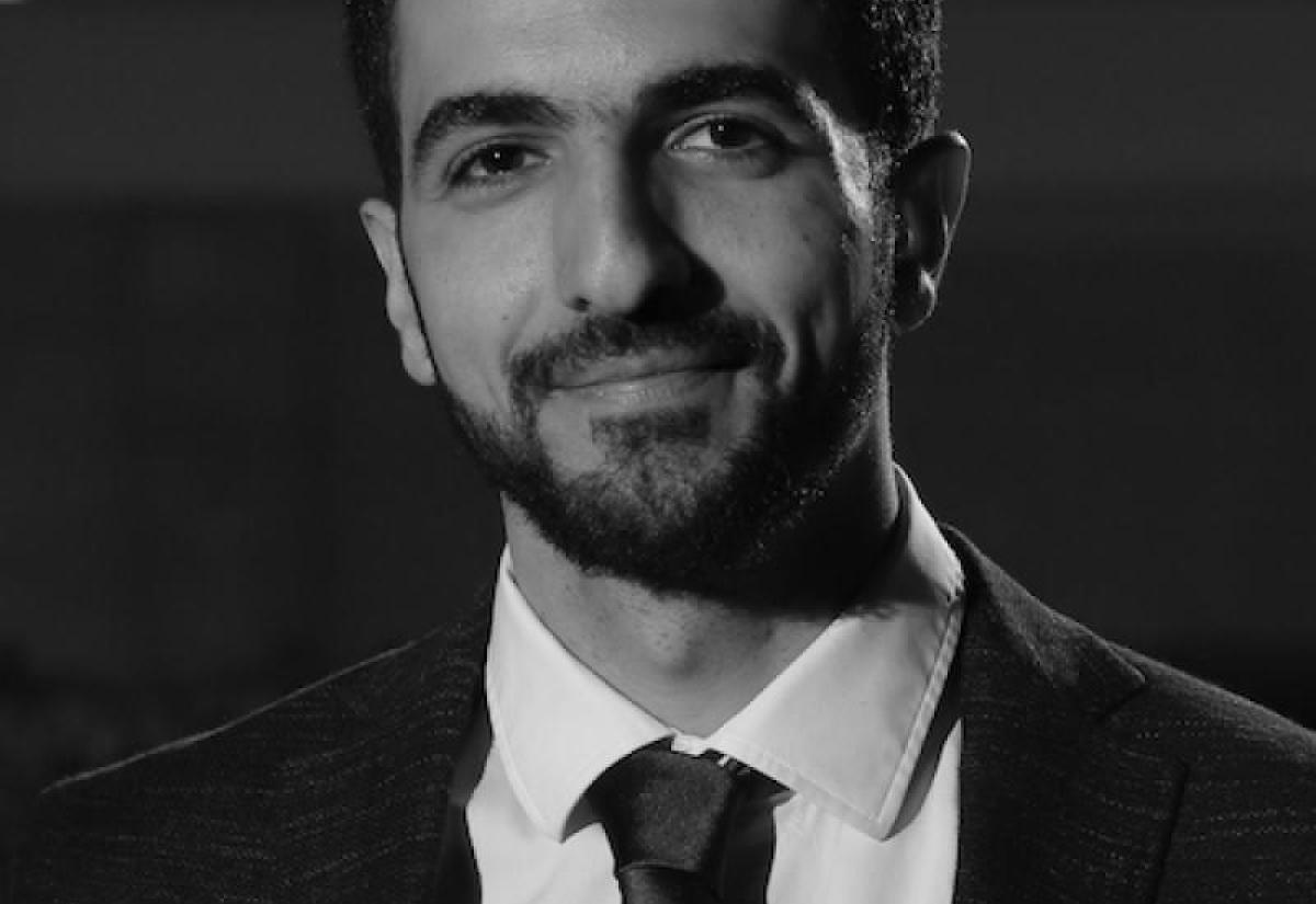 Ibrahim Olabi in a suit