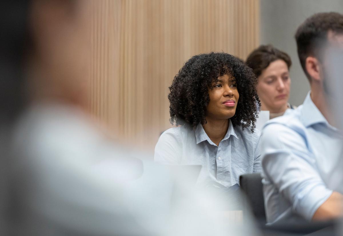Student listening in a lecture theatre setting