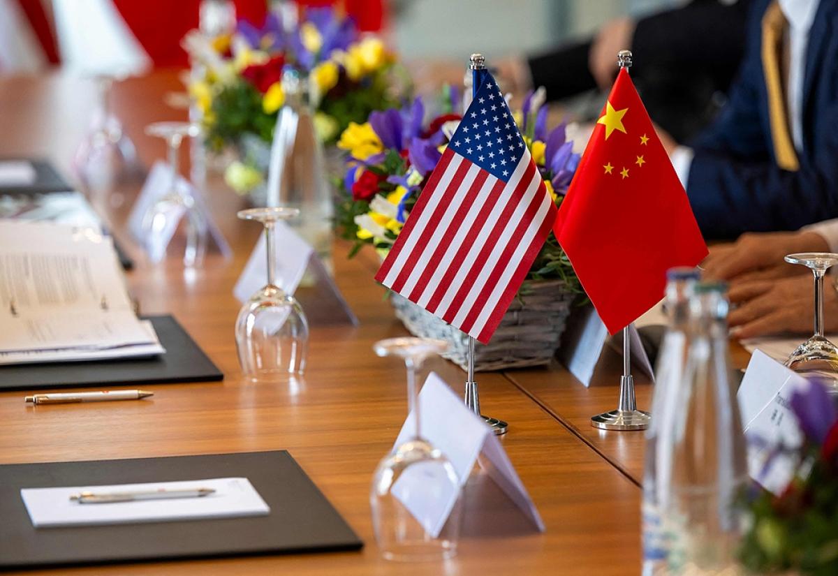 US and Chinese flags on a table