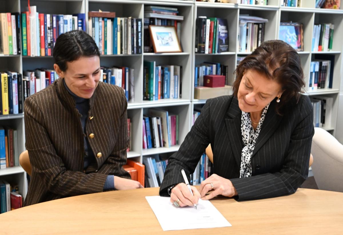 Ngaire signing letter