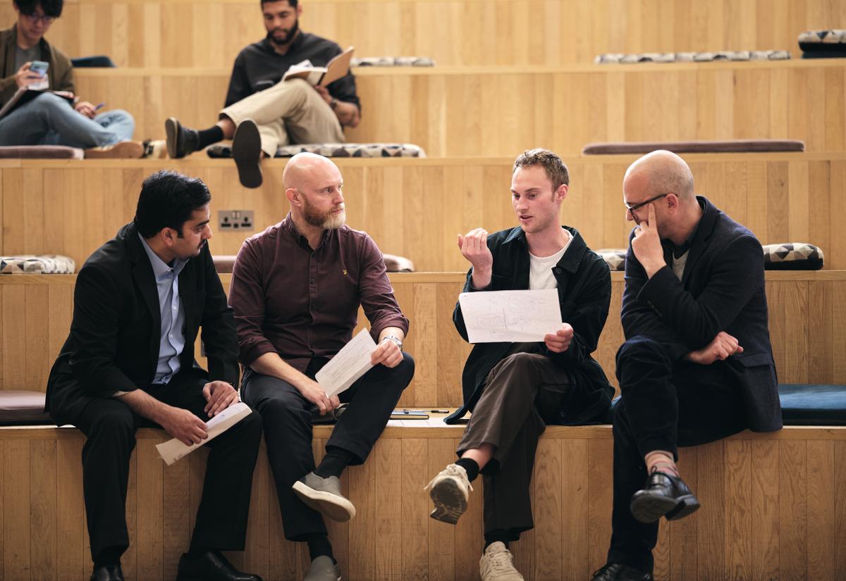 Group of course participants engaging in discussion