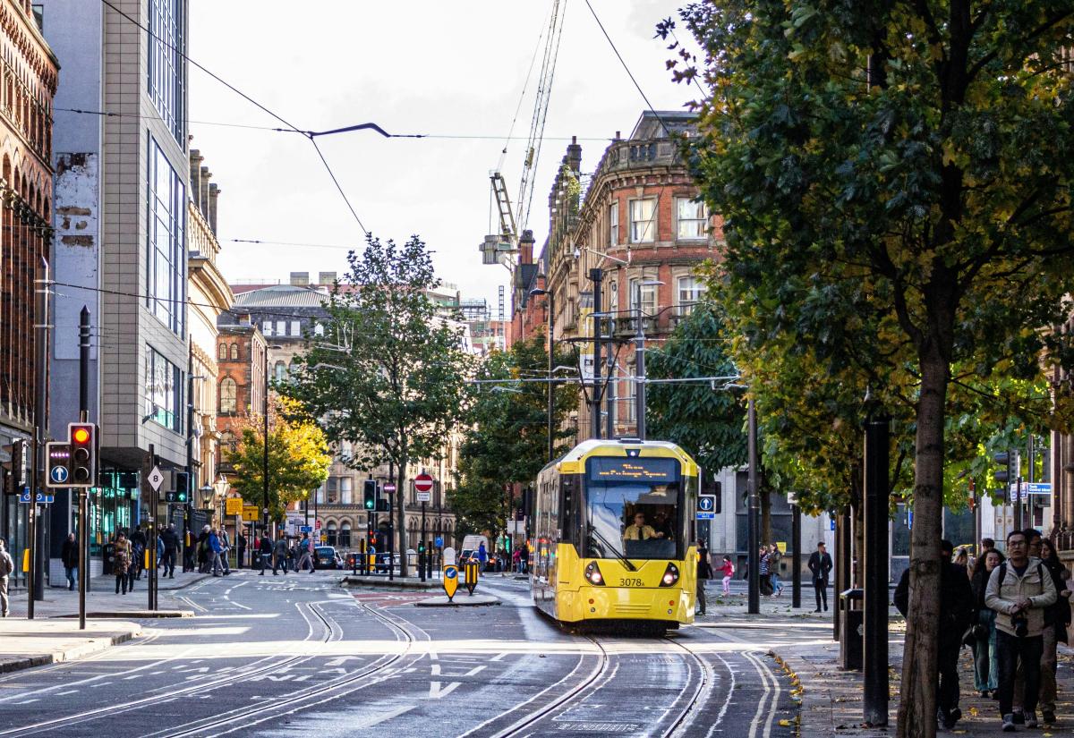 Princess Street, Manchester, UK, with a yellow and black tram