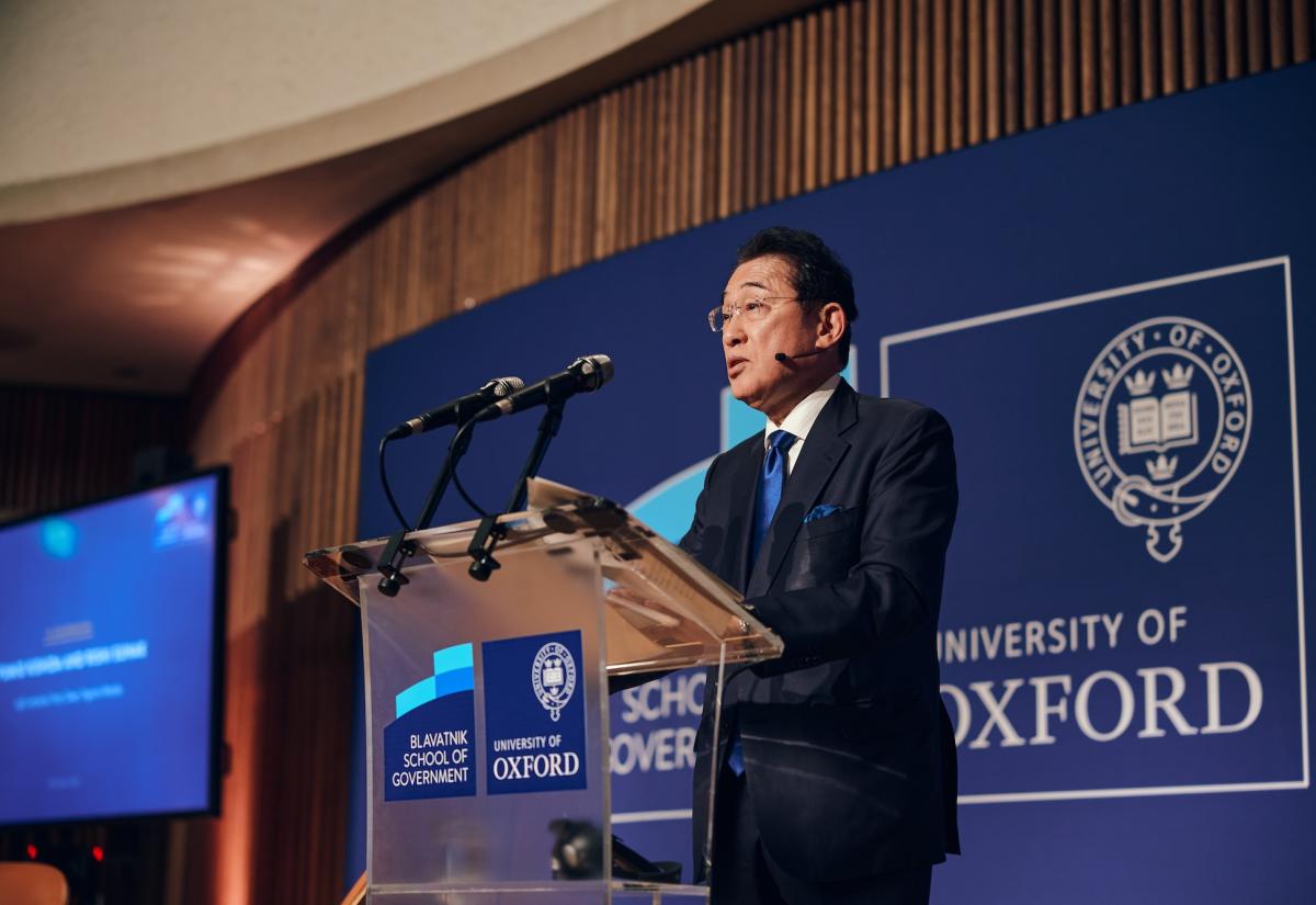 Fumio Kishida speaking on stage