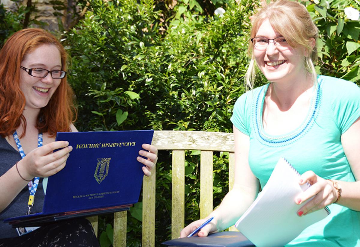 Sarah and Emily, our hard-working Admissions Team, look at some transcripts from prospective students.