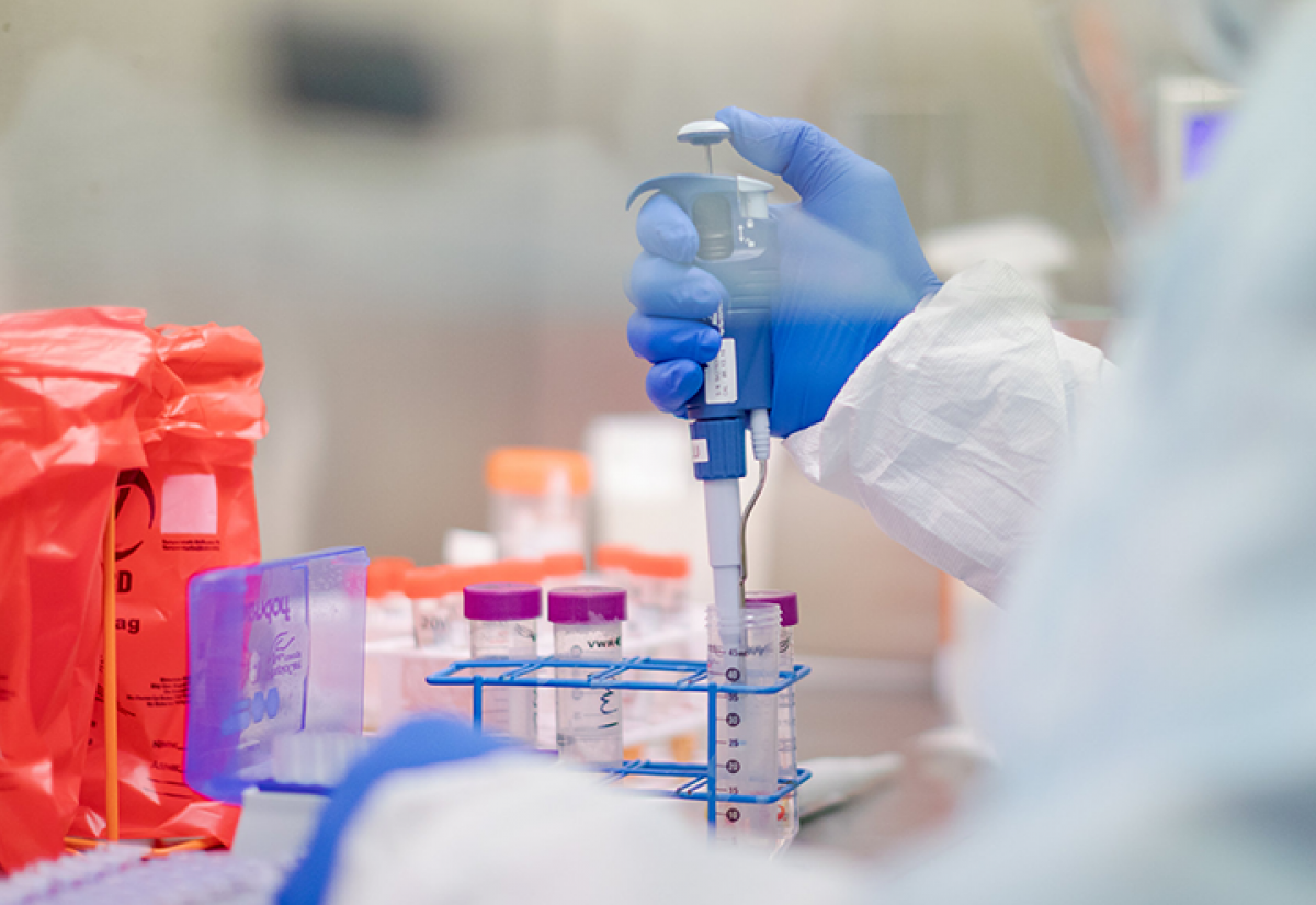 A microbiologist performing manual extraction of the coronavirus inside the extraction lab at the Pennsylvania Department of Health Bureau of Laboratories
