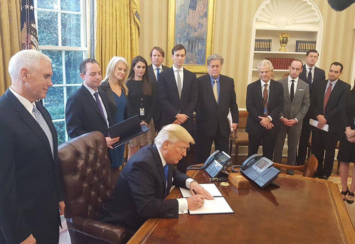 Donald Trump signs Executive Orders, January 2017. Source: Wikimedia Commons