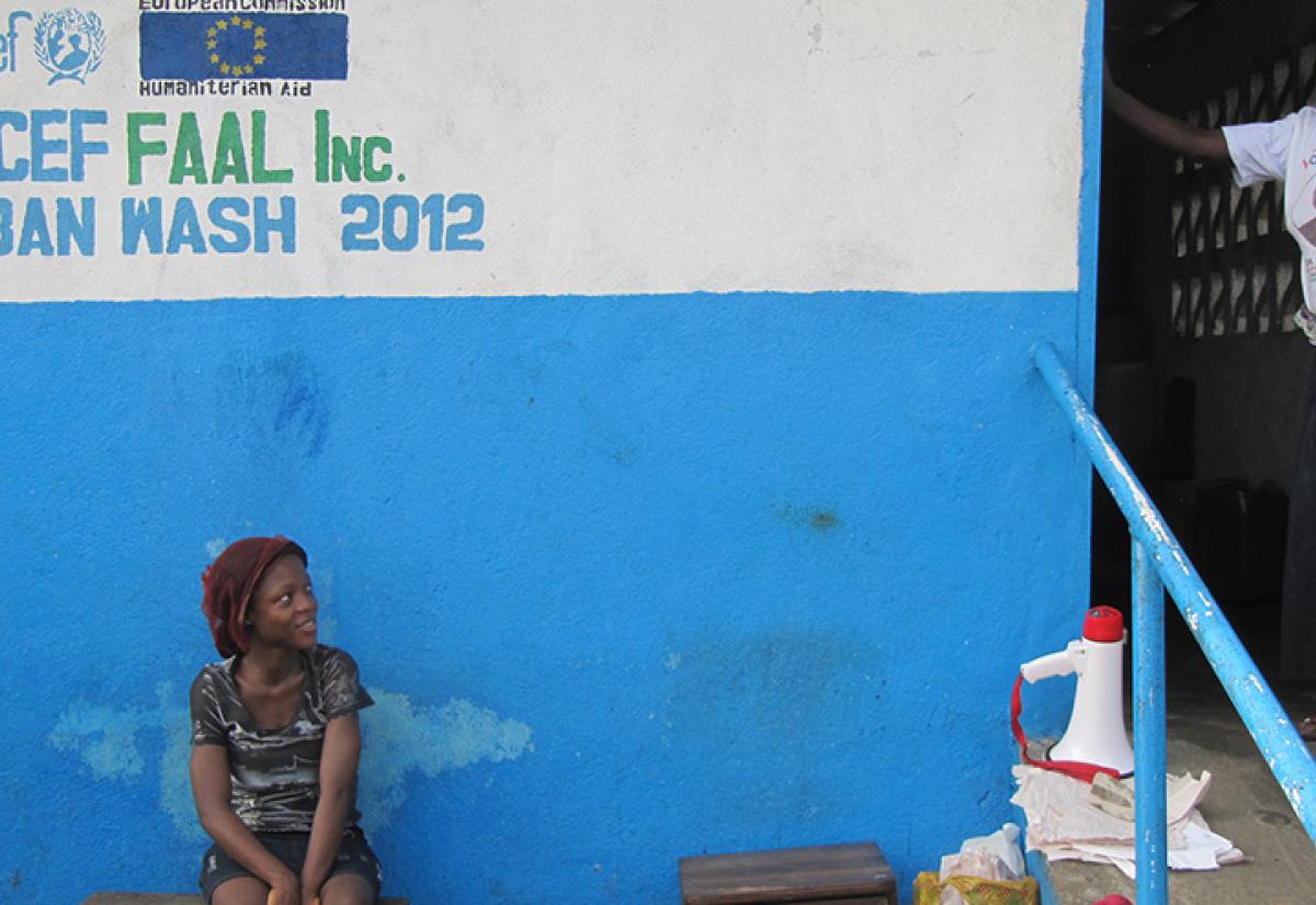The woman on the right is the proud caretaker of a public sanitation facility with separated toilets and showers for men and women. In a country where up to 77 percent of women say they have been the victim of sexual violence, it is important to minimize the risk of assault. Photo by European Commission DG Echo on Flickr