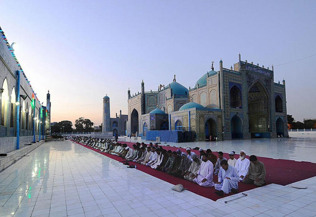 Men praying in Afghanistan