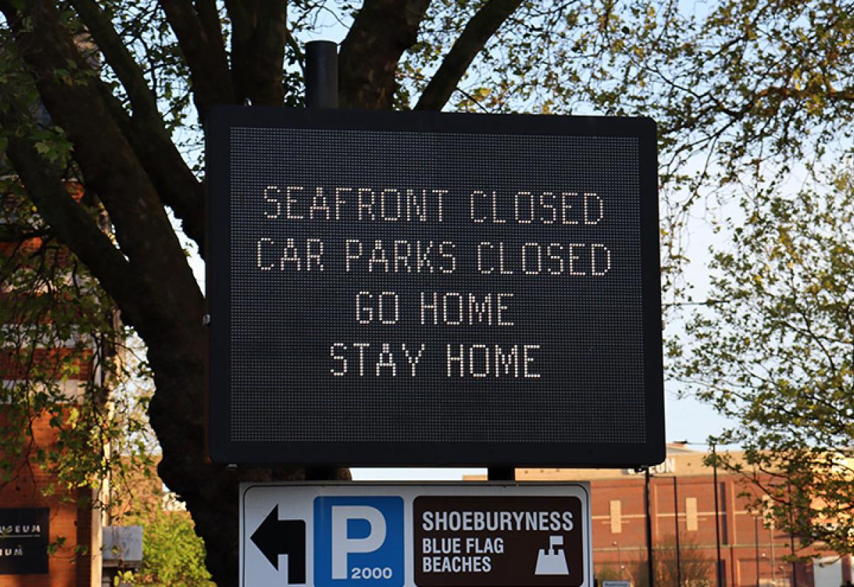 closed sign near beach