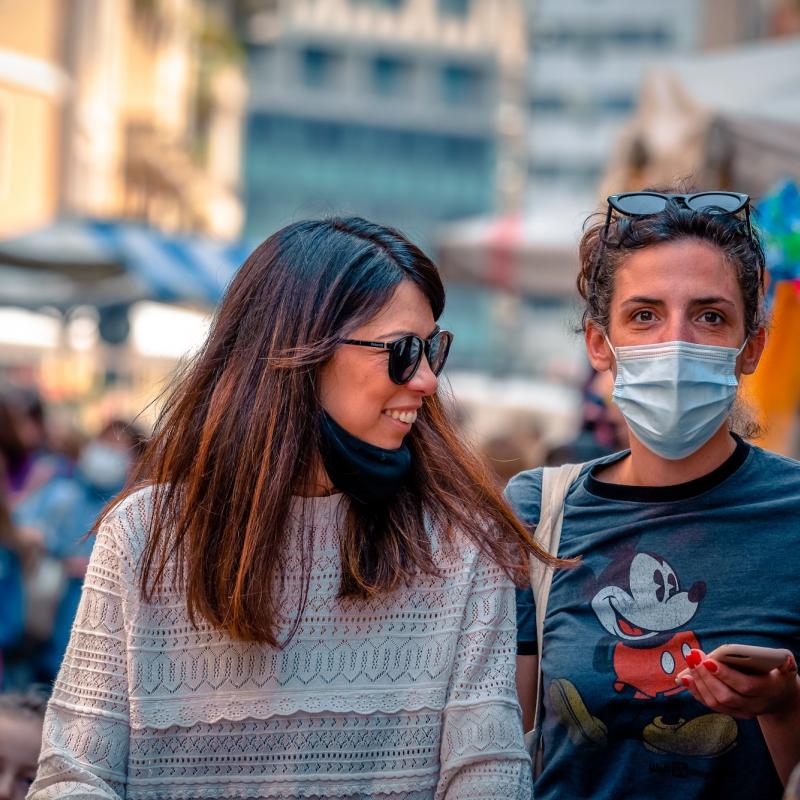 Women in market with facemasks 