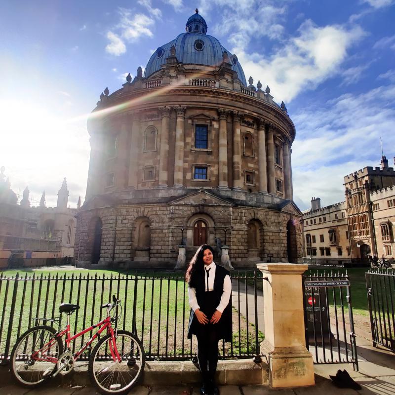 Ayushi Khare in front of the Radcliffe Camera